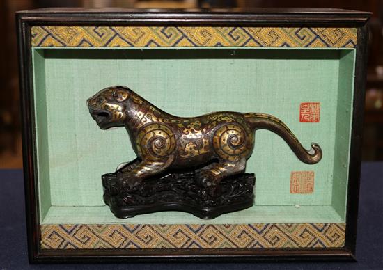 A Chinese parcel gilt bronze figure of a tiger, in Song dynasty style, length 18cm, together with a fitted hardwood box